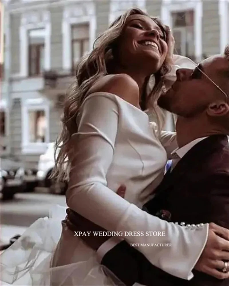 Princess-style wedding dress, long sleeve white gown with voluminous tulle skirt – bridal couture, wedding dress store