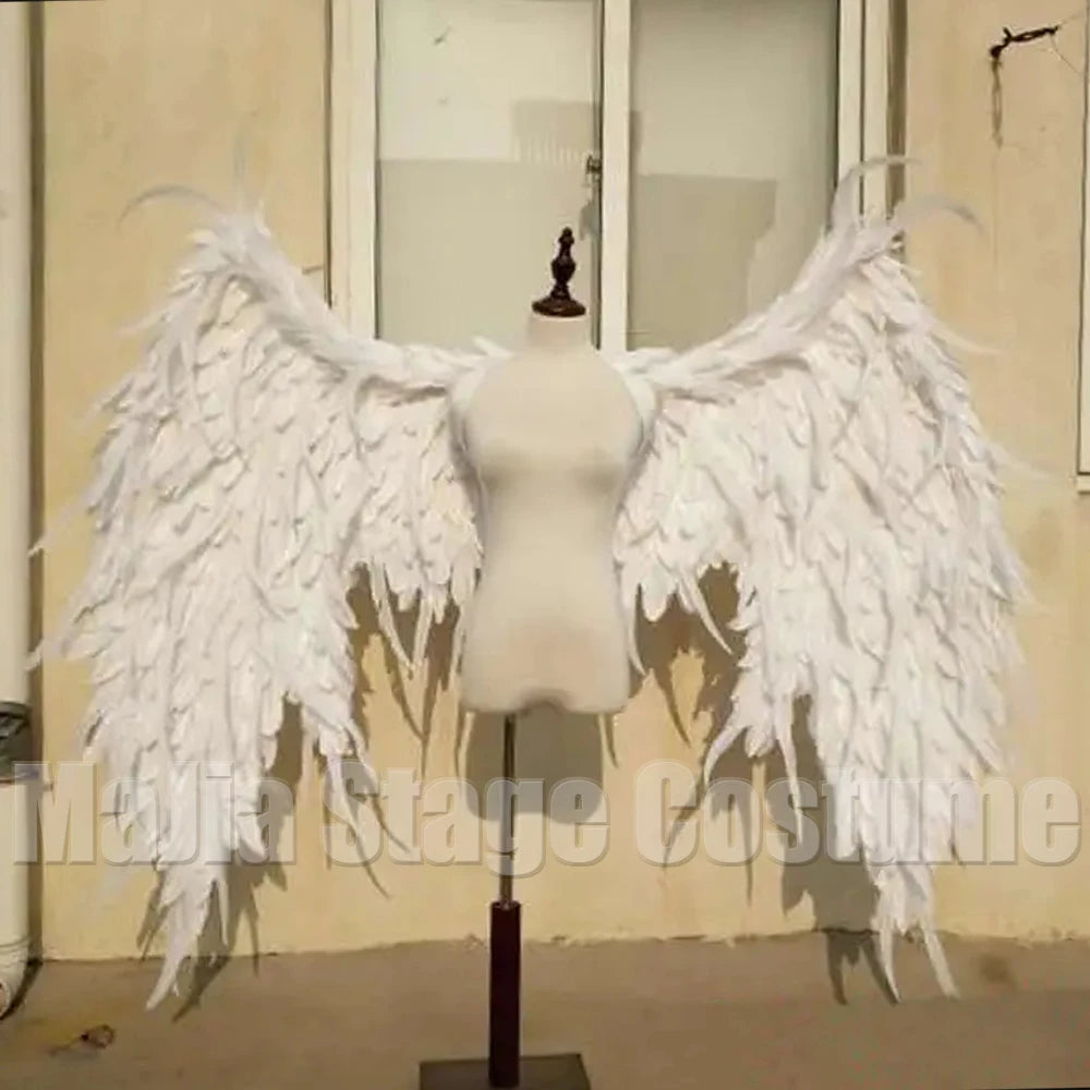 Ethereal white feather angel wings gown for bridal or cosplay – dramatic wedding dress, couture long train, angels-inspired bridal couture