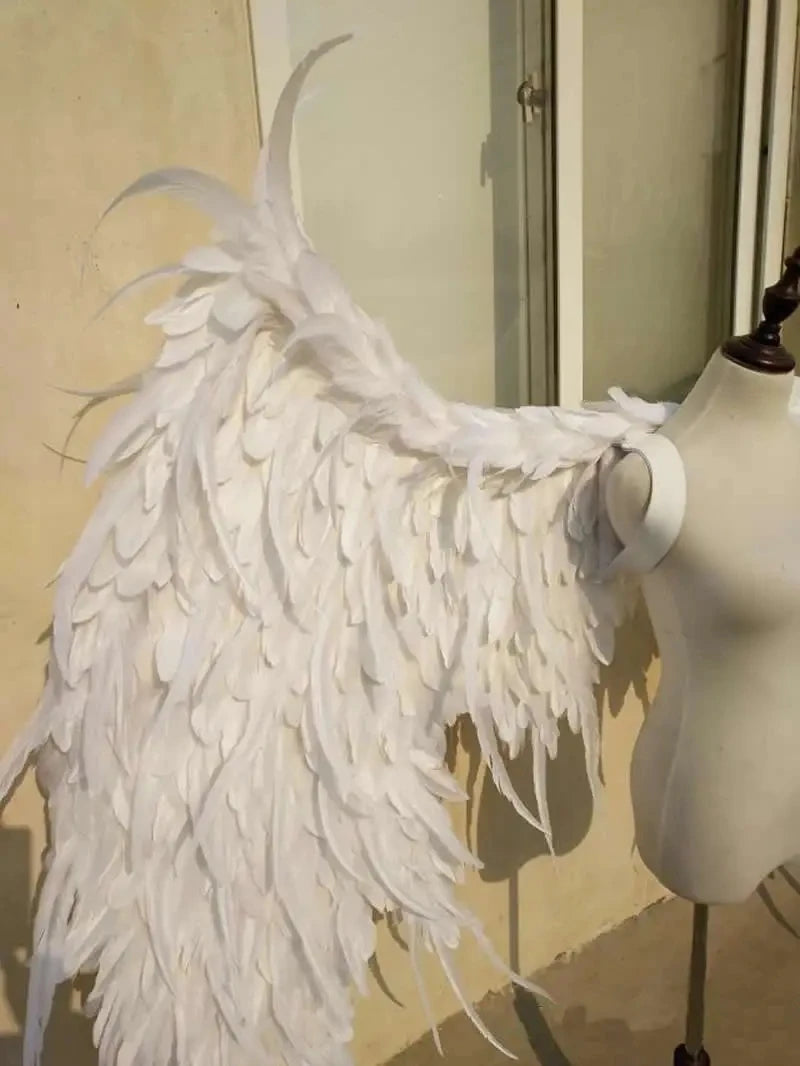 Ethereal white feather angel wings gown for bridal or cosplay – dramatic wedding dress, couture long train, angels-inspired bridal couture