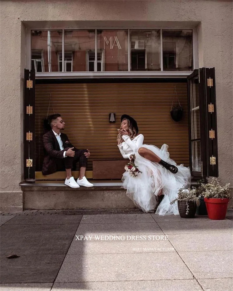 Princess-style wedding dress, long sleeve white gown with voluminous tulle skirt – bridal couture, wedding dress store