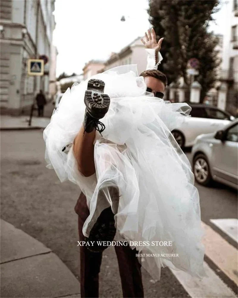 Princess-style wedding dress, long sleeve white gown with voluminous tulle skirt – bridal couture, wedding dress store