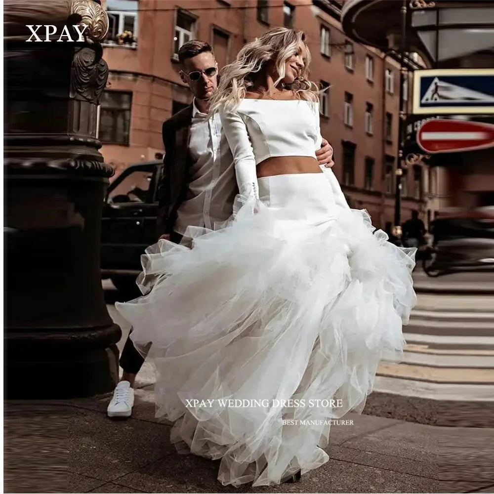 Princess-style wedding dress, long sleeve white gown with voluminous tulle skirt – bridal couture, wedding dress store