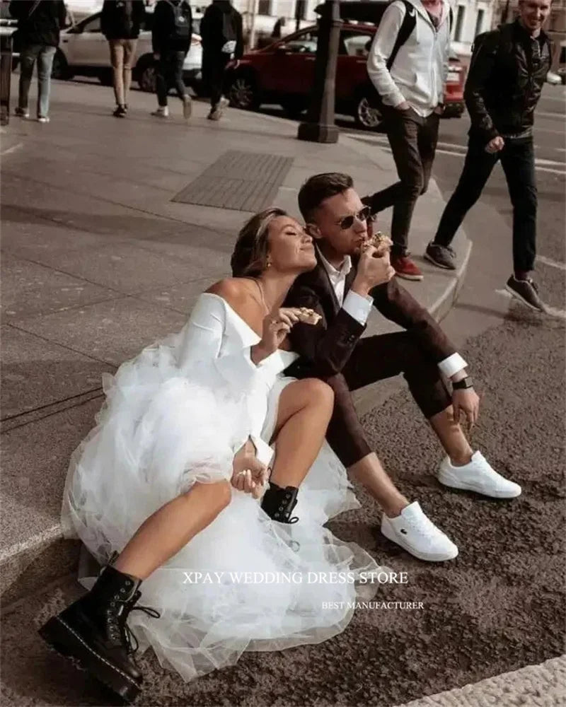 Princess-style wedding dress, long sleeve white gown with voluminous tulle skirt – bridal couture, wedding dress store