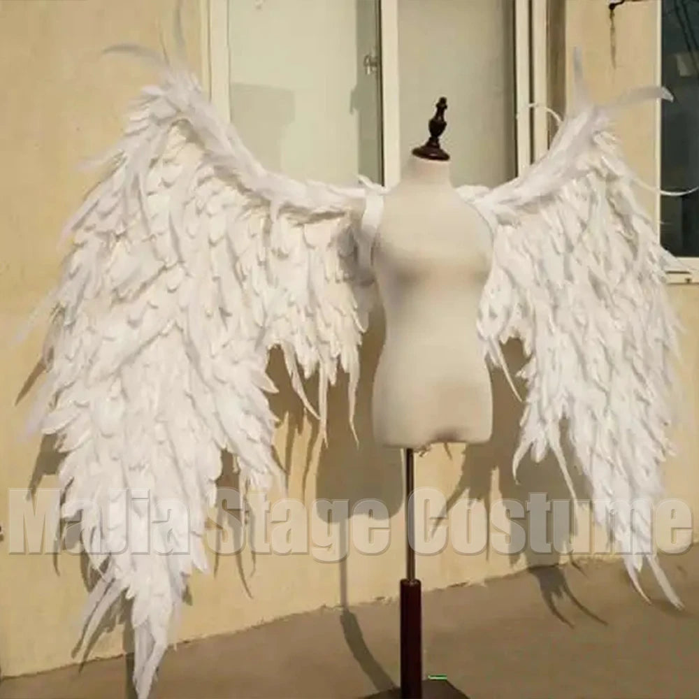 Ethereal white feather angel wings gown for bridal or cosplay – dramatic wedding dress, couture long train, angels-inspired bridal couture
